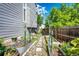 Side yard area has raised garden beds, metal archway, and a walking path at 1932 Sandhurst Dr, Castle Rock, CO 80104