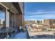 Scenic balcony view overlooking cityscape, snowy streets, and mountain vistas on a bright, sunny day at 20 Wilcox St # 518, Castle Rock, CO 80104