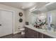 Stylish bathroom with dual sinks, decorative mirrors, and contemporary design elements at 20 Wilcox St # 518, Castle Rock, CO 80104