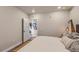 Comfortable bedroom with neutral tones, a large bed, and inviting decor at 20 Wilcox St # 518, Castle Rock, CO 80104