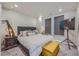 Cozy bedroom with a large bed, accent pillows, and TV with a modern design at 20 Wilcox St # 518, Castle Rock, CO 80104