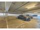 Reserved parking spot in a well-lit garage with a modern vehicle at 20 Wilcox St # 518, Castle Rock, CO 80104