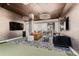 Game room featuring a golf simulator, comfortable seating areas, modern finishes and a large TV at 20 Wilcox St # 518, Castle Rock, CO 80104