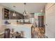 Modern kitchen featuring gray cabinets, stainless steel appliances, and trendy stools at the counter at 20 Wilcox St # 518, Castle Rock, CO 80104