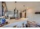 Bright kitchen with stainless appliances and hardwood floors offering access to the unit's unique entryway at 20 Wilcox St # 518, Castle Rock, CO 80104