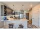 Modern kitchen with stainless steel appliances, stylish cabinets, and pendant lighting at 20 Wilcox St # 518, Castle Rock, CO 80104