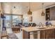 Bright open living room with modern kitchen, hardwood floors, and scenic views at 20 Wilcox St # 518, Castle Rock, CO 80104