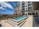 Rooftop terrace featuring a hot tub and lounge furniture, with views of mountains at 20 Wilcox St # 518, Castle Rock, CO 80104