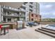 Luxurious rooftop terrace with outdoor kitchen, seating, firepit and hot tub, offering a perfect space for relaxing at 20 Wilcox St # 518, Castle Rock, CO 80104