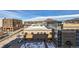 Wide, elevated view of the city including rooftops and beautiful mountains off in the distance under a gorgeous blue sky at 20 Wilcox St # 518, Castle Rock, CO 80104