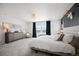 Cozy bedroom offers comfortable carpeting, generous natural light, and neutral tones at 15194 W Washburn Ave, Lakewood, CO 80228