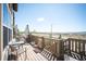 Enjoy panoramic views from this deck with wood flooring, built-in BBQ grill, and plenty of seating space at 15194 W Washburn Ave, Lakewood, CO 80228