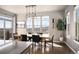 Dining room with an eye to the views and a sliding glass door to an outdoor patio at 15194 W Washburn Ave, Lakewood, CO 80228