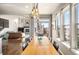 Dining area with modern lighting, mountain views and slider to outdoor patio area at 15194 W Washburn Ave, Lakewood, CO 80228