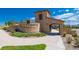 A stone entrance to the Solterra community with lush landscaping at 15194 W Washburn Ave, Lakewood, CO 80228