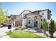 Attractive two-story house with stone accents, a landscaped yard, and a 'coming soon' sign at 15194 W Washburn Ave, Lakewood, CO 80228