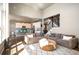 Open living room with modern furnishings, great lighting, and eat in kitchen area at 15194 W Washburn Ave, Lakewood, CO 80228