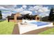 Luxury pool with a large deck and mountain views in the background at 11168 Wild Chase Pl, Franktown, CO 80116