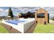 Luxury pool with a waterfall feature, spacious deck, and mountain views at 11168 Wild Chase Pl, Franktown, CO 80116