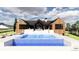 Stunning pool with a waterfall feature, expansive deck, and mountain views at 11168 Wild Chase Pl, Franktown, CO 80116