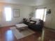 Bright and inviting living room with wood floors, comfortable seating, and natural light at 569 Alton Way # E, Denver, CO 80230