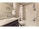 Clean bathroom featuring a shower-tub combo, modern vanity, and fresh towels at 16057 E 47Th Pl, Denver, CO 80239