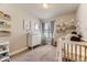Cozy Bedroom with soft lighting, a crib, dresser and charming decor, creating a soothing and nurturing environment at 16057 E 47Th Pl, Denver, CO 80239