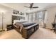 Well-lit main bedroom with a large bed, neutral decor, and bright windows for a cozy and serene space at 16057 E 47Th Pl, Denver, CO 80239
