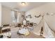 Playful bedroom with whimsical decor, toys, and natural light creating an inspiring and cozy space at 16057 E 47Th Pl, Denver, CO 80239