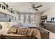 Bright main bedroom boasts a spacious layout, stylish decor, and ample natural light for a comfortable retreat at 16057 E 47Th Pl, Denver, CO 80239