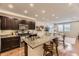 Spacious kitchen with granite countertops, stainless steel appliances, and open floor plan at 16057 E 47Th Pl, Denver, CO 80239