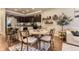 Inviting kitchen and dining area, featuring dark cabinetry and a cozy breakfast nook with seating at 16057 E 47Th Pl, Denver, CO 80239