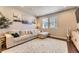 Cozy living room featuring hardwood floors, a comfortable sofa, and stylish decor at 16057 E 47Th Pl, Denver, CO 80239