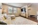 Inviting living room with hardwood floors, stylish furnishings, and plenty of natural light at 16057 E 47Th Pl, Denver, CO 80239