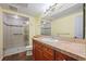 Bathroom featuring a walk-in shower with tile surround and a single sink vanity with granite countertop at 8100 E Union Ave # 614, Denver, CO 80237