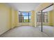 Bedroom featuring a mirrored closet and a large window with a view of the city at 8100 E Union Ave # 614, Denver, CO 80237