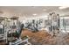 Spacious fitness center with a variety of cardio equipment, weight machines, and plenty of natural light at 8100 E Union Ave # 614, Denver, CO 80237