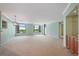 Bright living room with large windows and an adjacent nook for storage at 8100 E Union Ave # 614, Denver, CO 80237