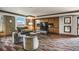 Cozy residents' lounge with a built-in entertainment center, comfortable seating, and stylish decor at 8100 E Union Ave # 614, Denver, CO 80237