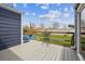 Back deck featuring a small table and backyard access at 1995 Xenia St, Denver, CO 80220