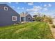 Large backyard with well maintained lawn and surrounding fence at 1995 Xenia St, Denver, CO 80220