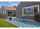 A view of the backyard patio featuring a bright blue outdoor rug and outdoor seating at 1995 Xenia St, Denver, CO 80220