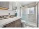 Modern bathroom with a glass-enclosed shower, sleek vanity, and stylish fixtures at 1995 Xenia St, Denver, CO 80220