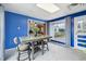 Cozy dining area with a table, chairs, and window with backyard views, offering a bright and inviting space at 1995 Xenia St, Denver, CO 80220