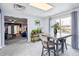 Dining room view features a table, access to the backyard, and an adjacent living room at 1995 Xenia St, Denver, CO 80220