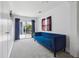 Bright room with plush blue velvet couch, sliding glass doors to a deck, and a large window at 1995 Xenia St, Denver, CO 80220