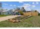 Landscaped front yard with beautiful flowers and a basketball hoop near the house at 1995 Xenia St, Denver, CO 80220