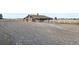 Brown barn featuring white crossbuck doors and a gravel lot at 451 W 152Nd Ave, Broomfield, CO 80023