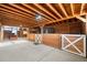 Spacious barn interior with high ceilings, horse stalls, and bright lighting at 451 W 152Nd Ave, Broomfield, CO 80023