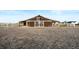 View of a barn with gravel in front, featuring wooden doors, white trim and a white fence at 451 W 152Nd Ave, Broomfield, CO 80023